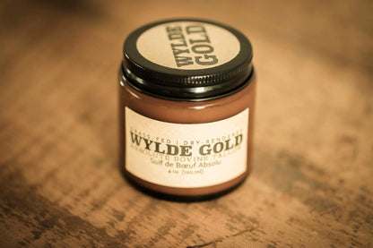WYLDE GOLD Absolute Balm — unscented grass-fed tallow ritual in a jar on wood