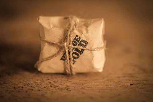 WYLDE GOLD Savage Balm —  grass-fed tallow muscle relief hot/cold balm block wrapped  in kraft on rustic wood
