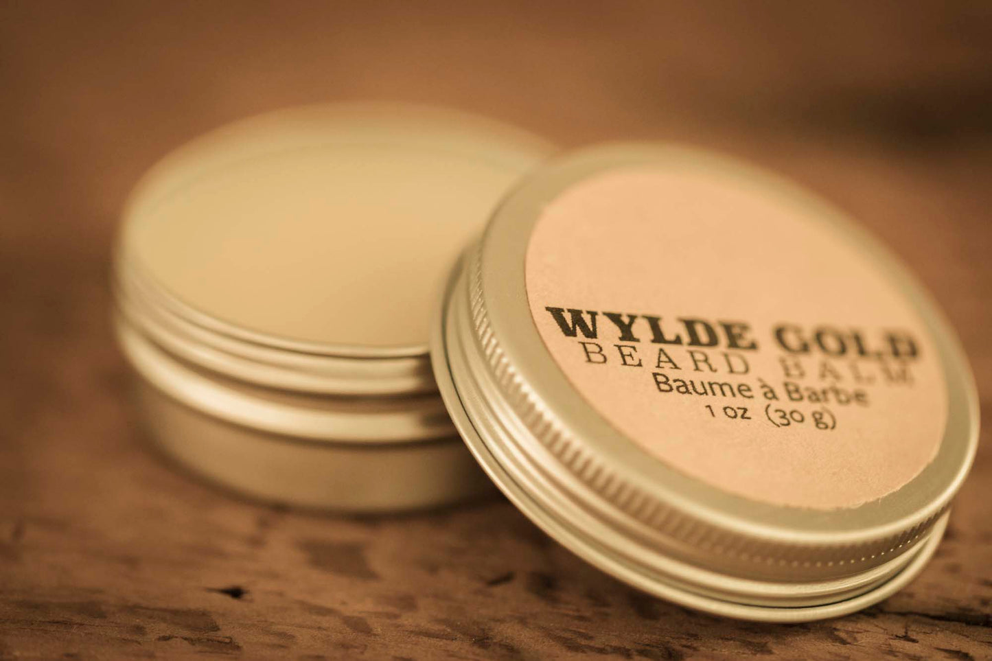WYLDE GOLD Beard Balm —  grass-fed tallow balm in a tin on rustic wood