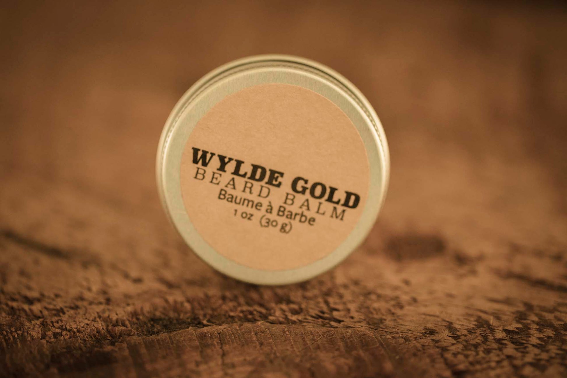 WYLDE GOLD Beard Balm —  grass-fed tallow balm in a tin on rustic wood